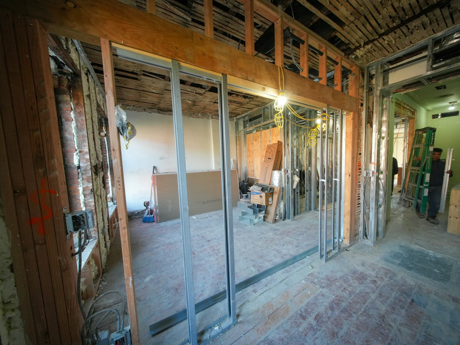 Interior construction with exposed beams and framing.